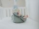 Cute baby feet in pajamas on a soft white crib. Perfect for children's room decor.