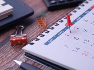 Desk elements like calendar and pins for effective planning.